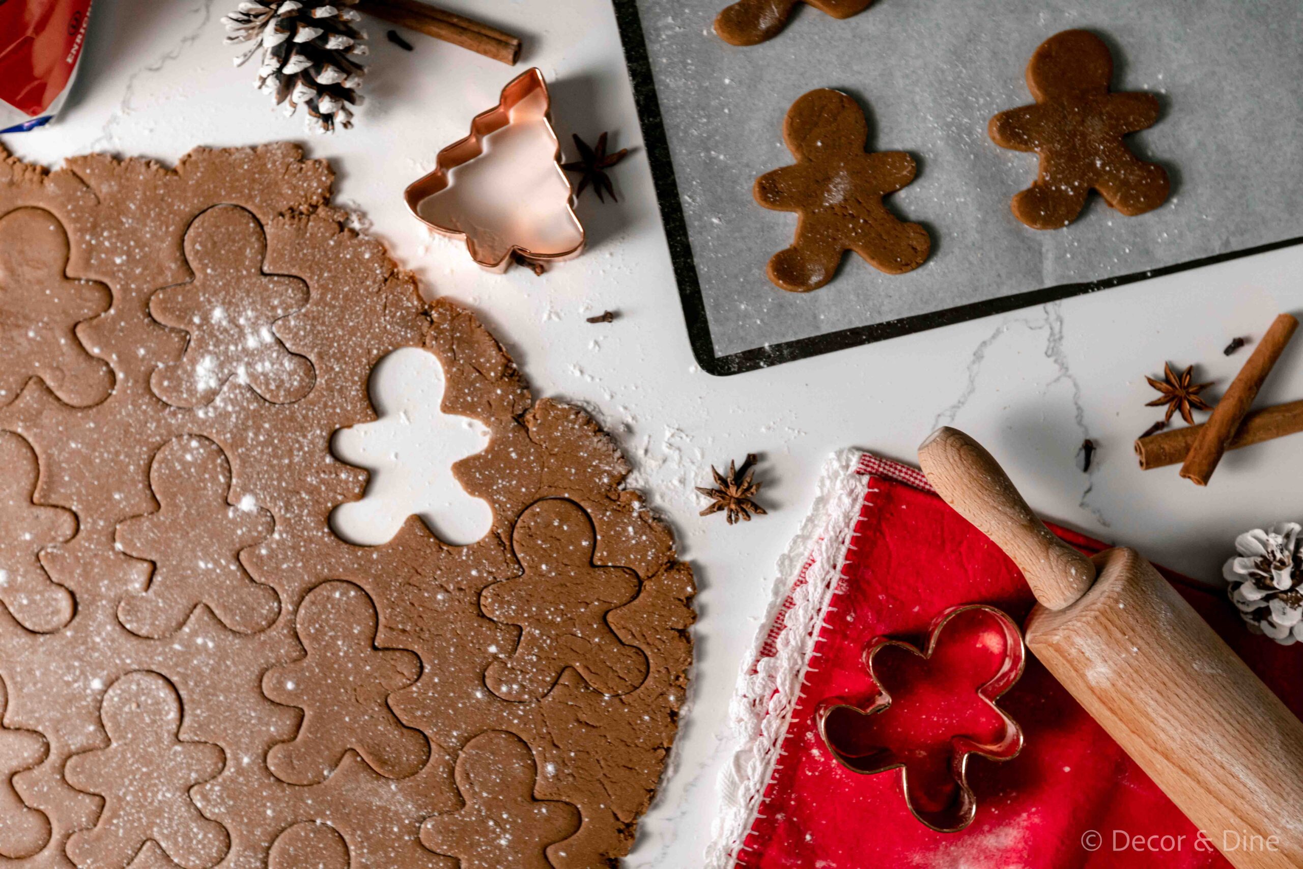 Gingerbread dough with gingerbread men shapes cut out