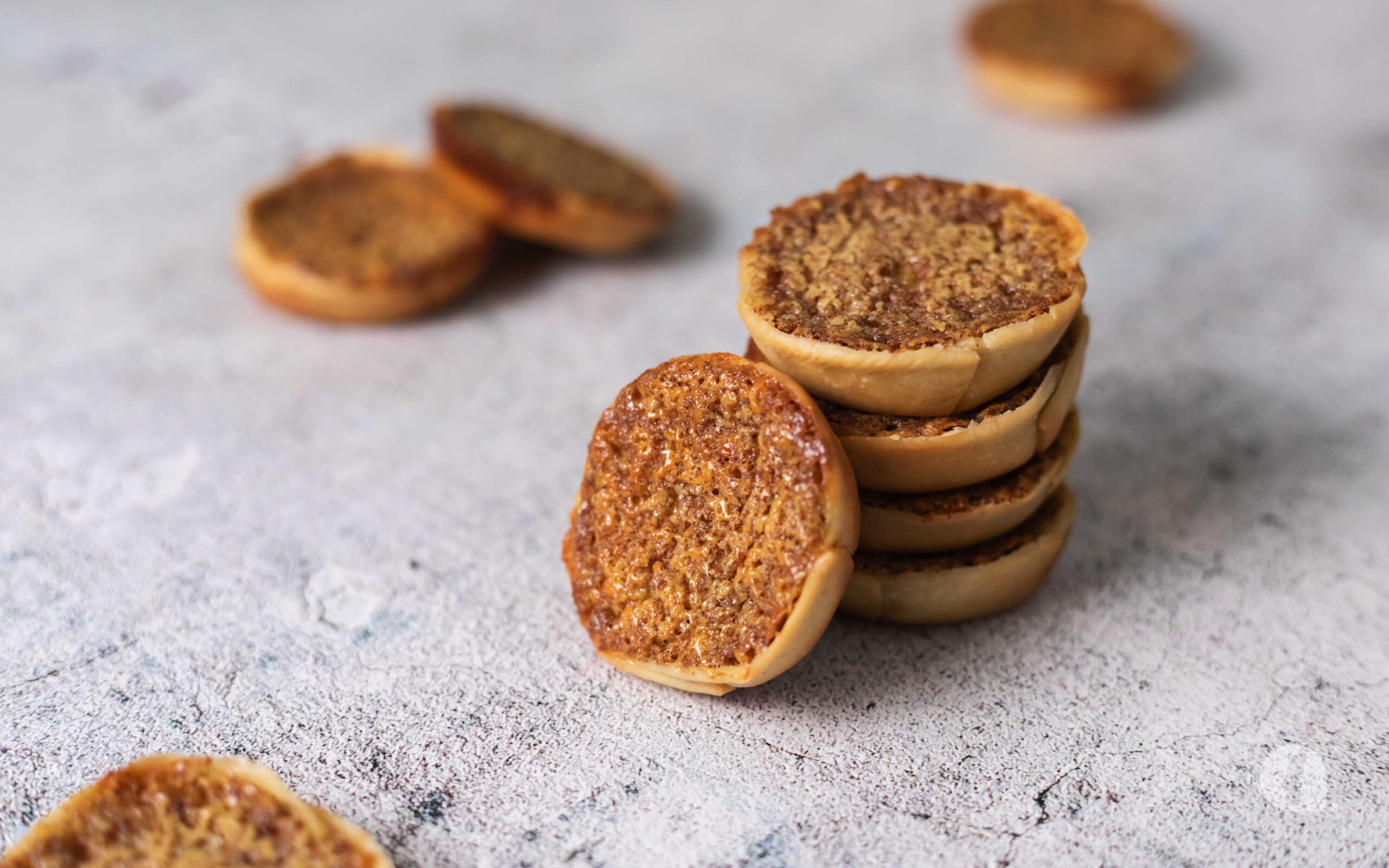 Queijadas de Sintra stacked on top of each other.